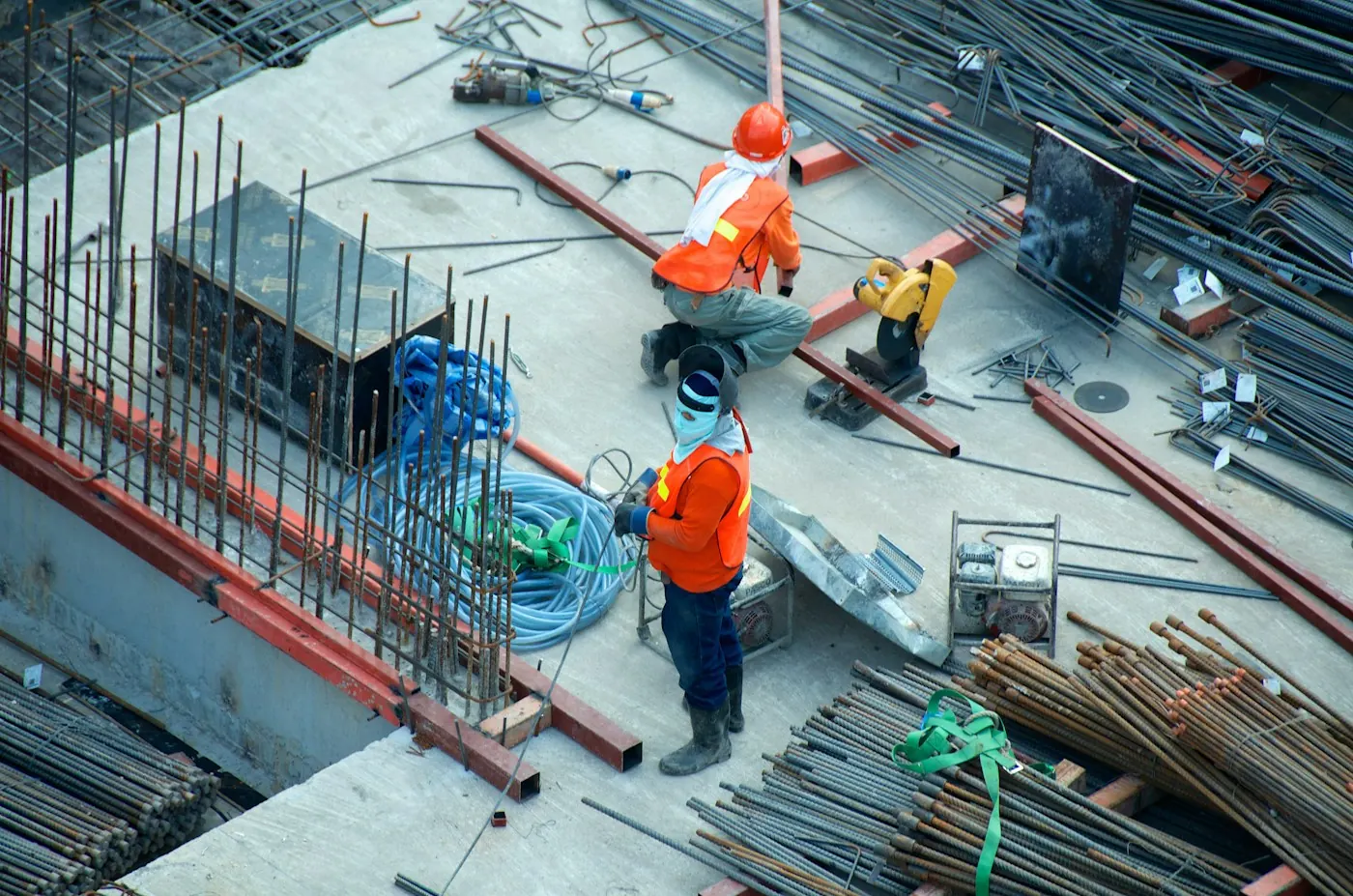 Construction workers on a building site seen from above