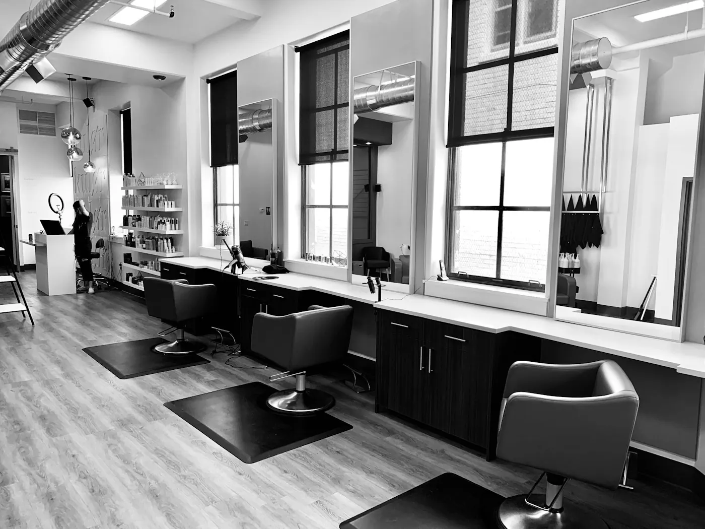 Interior of a hair salon with styling chairs and mirrors