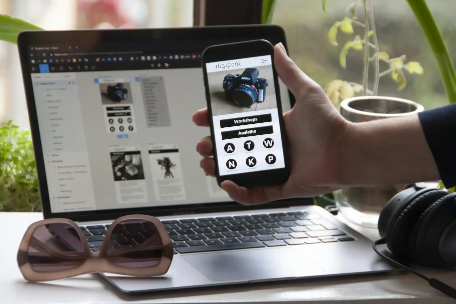 Laptop showing a product admin interface next to a phone running the matching app